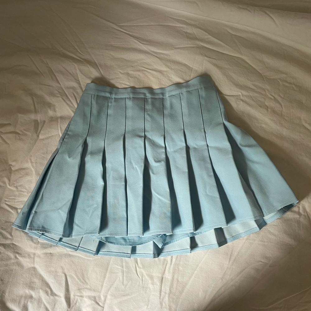 blue pleated skirt